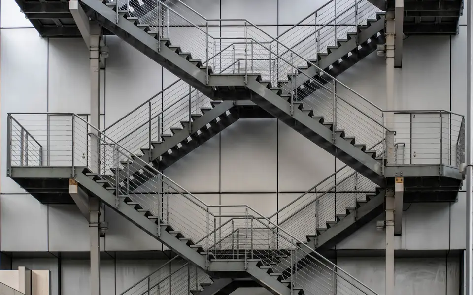 Videographer filming a grand staircase