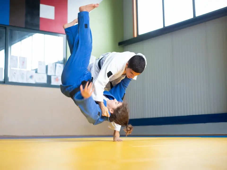 Judo throw practice on tatami mats