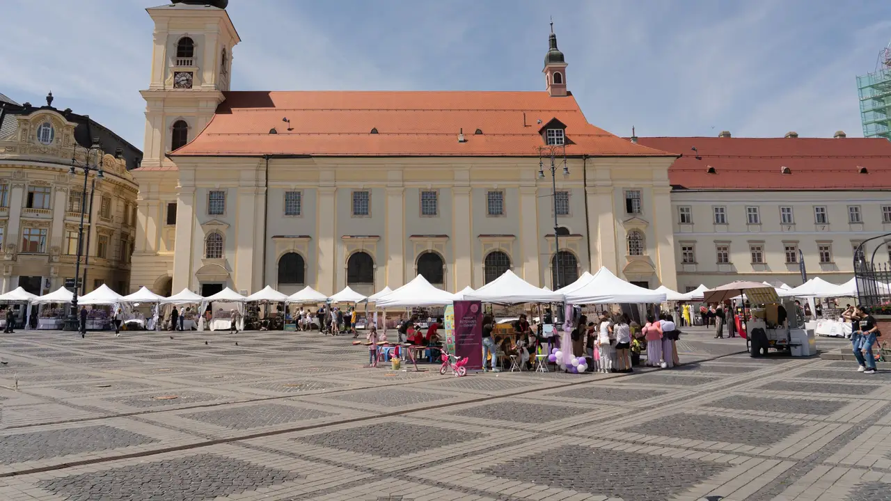 Market stalls on the square in front of the town hall