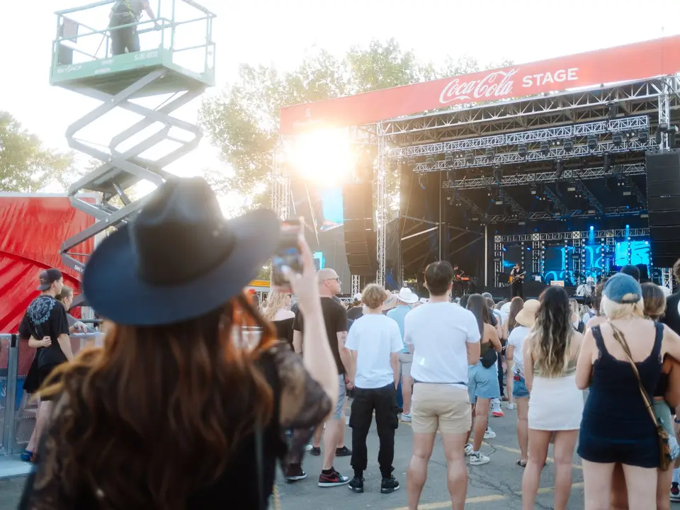 Daytime crowd at an outdoor stage