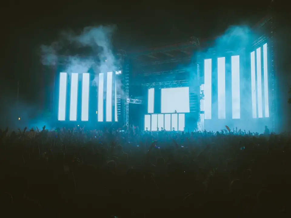 Stage with large screens at night
