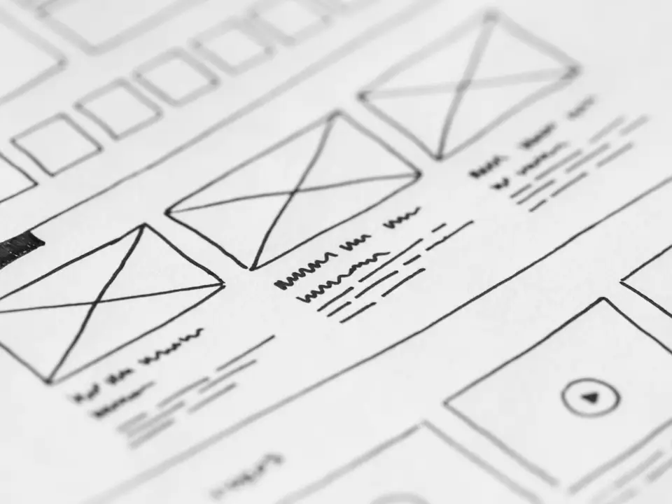 Hand-drawn wireframe design on paper for a UX project