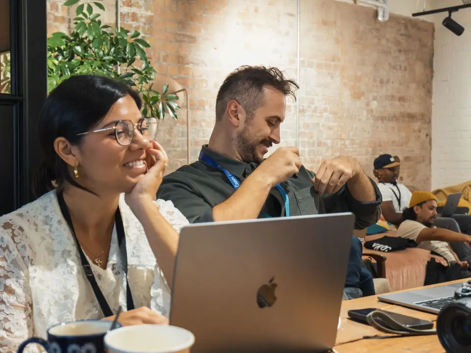Diverse team in a casual meeting with laptops and discussion