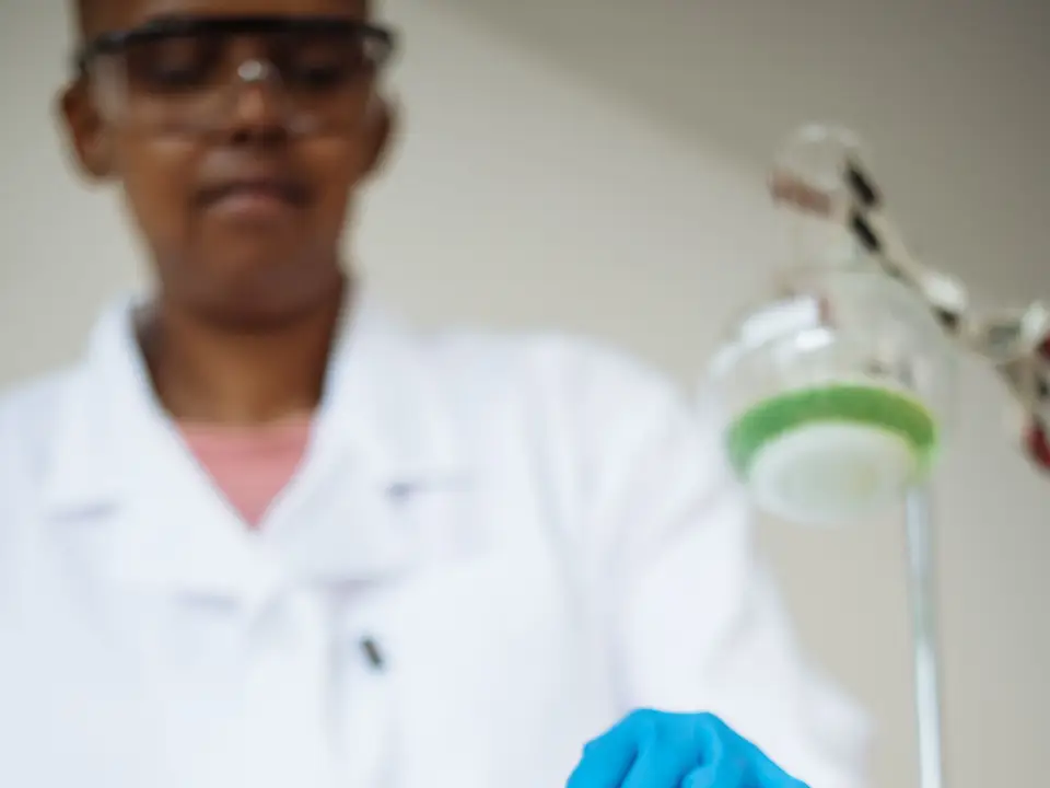 Lab technician testing soil samples in an agriculture lab