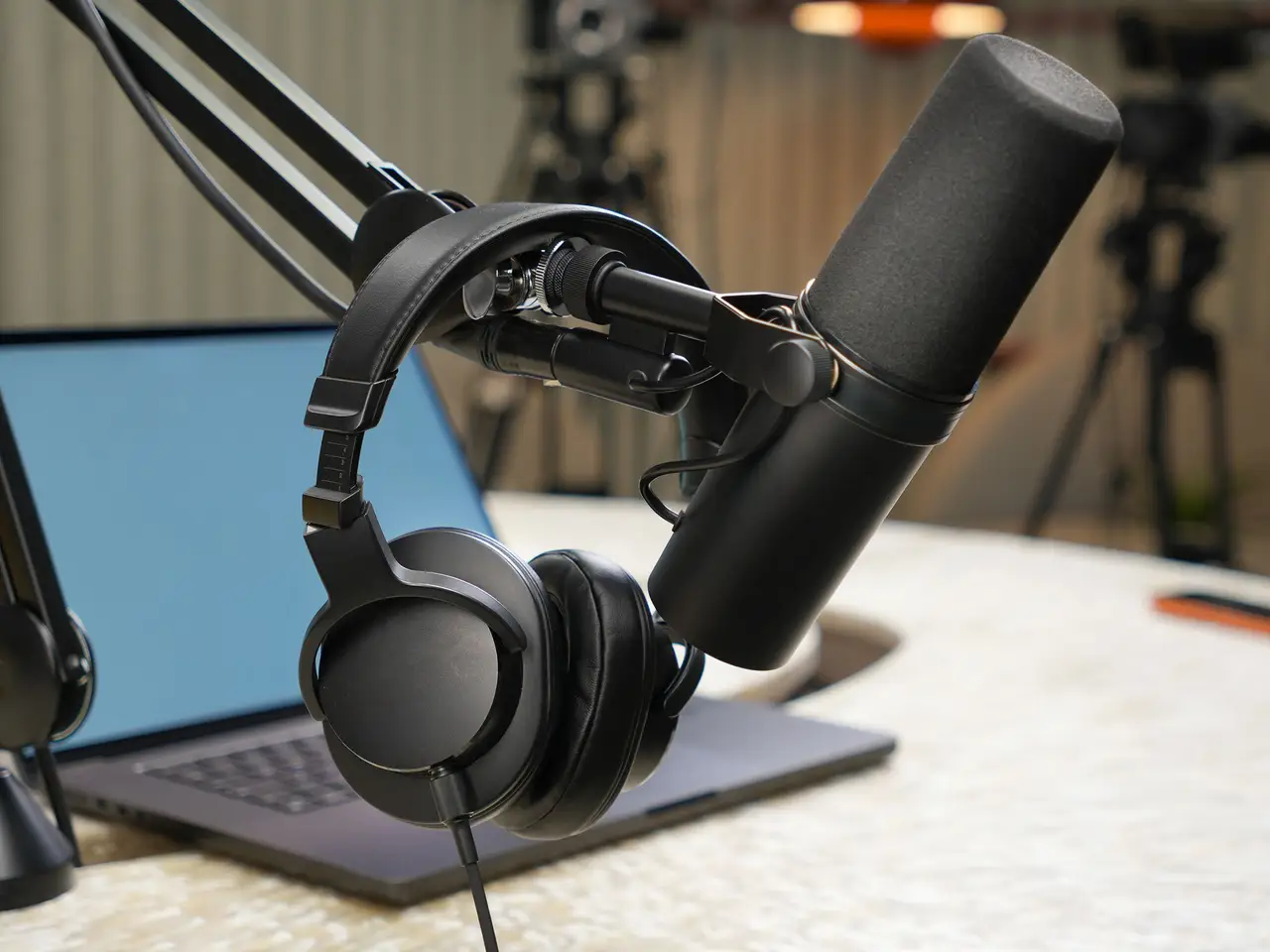 Studio microphone and headphones on the Foundry Hour recording desk