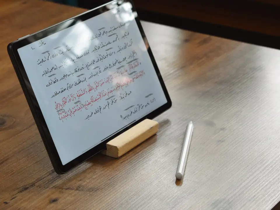 Close view of cursive handwriting on a tablet screen