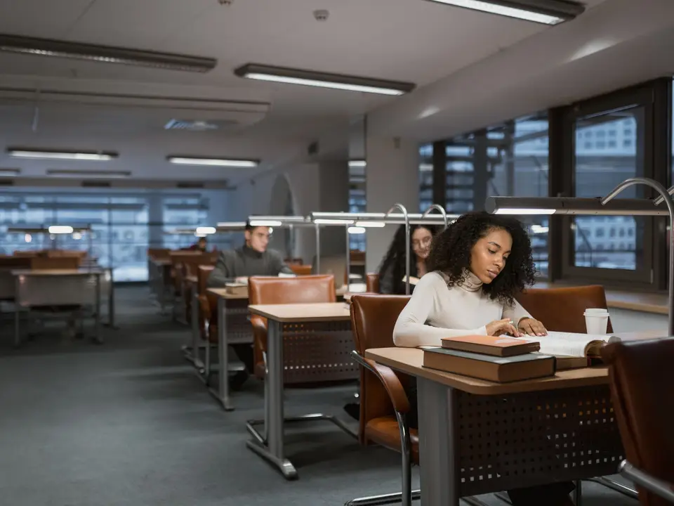 Study room with individual desks and reading lamps