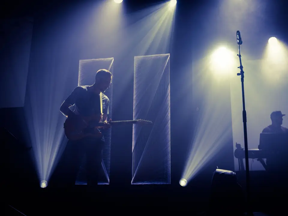 Guitarist on a small club stage