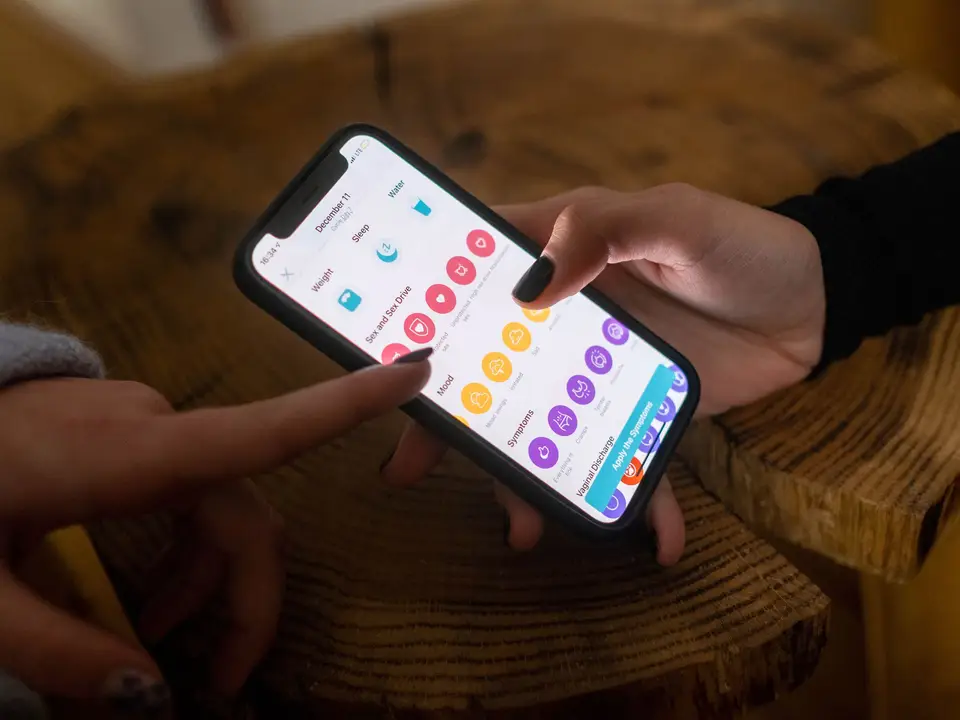 Hands checking an account on a mobile app