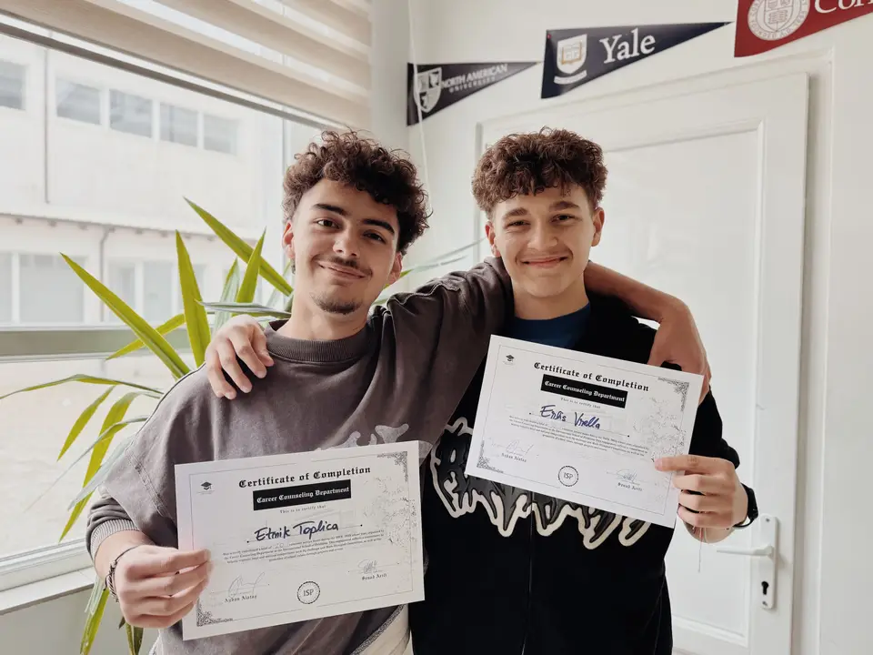 Students holding award certificates