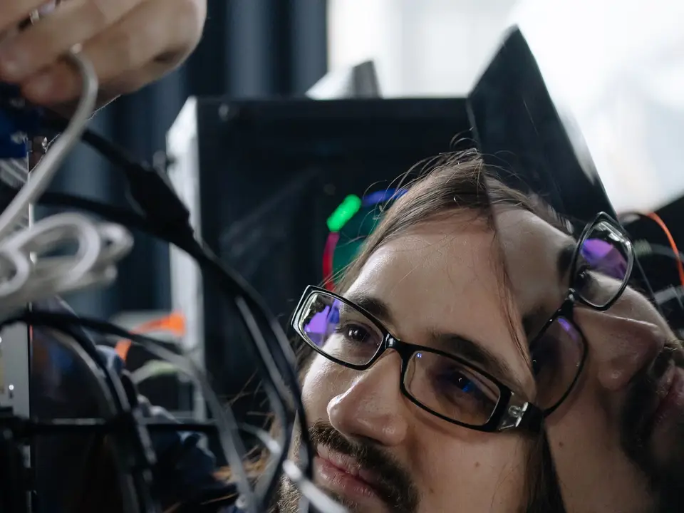 System administrator sorting network cables in a rack