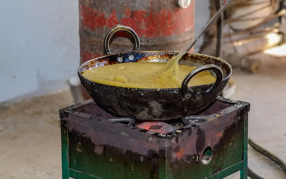 Vegetable curry simmering in a large kadhai