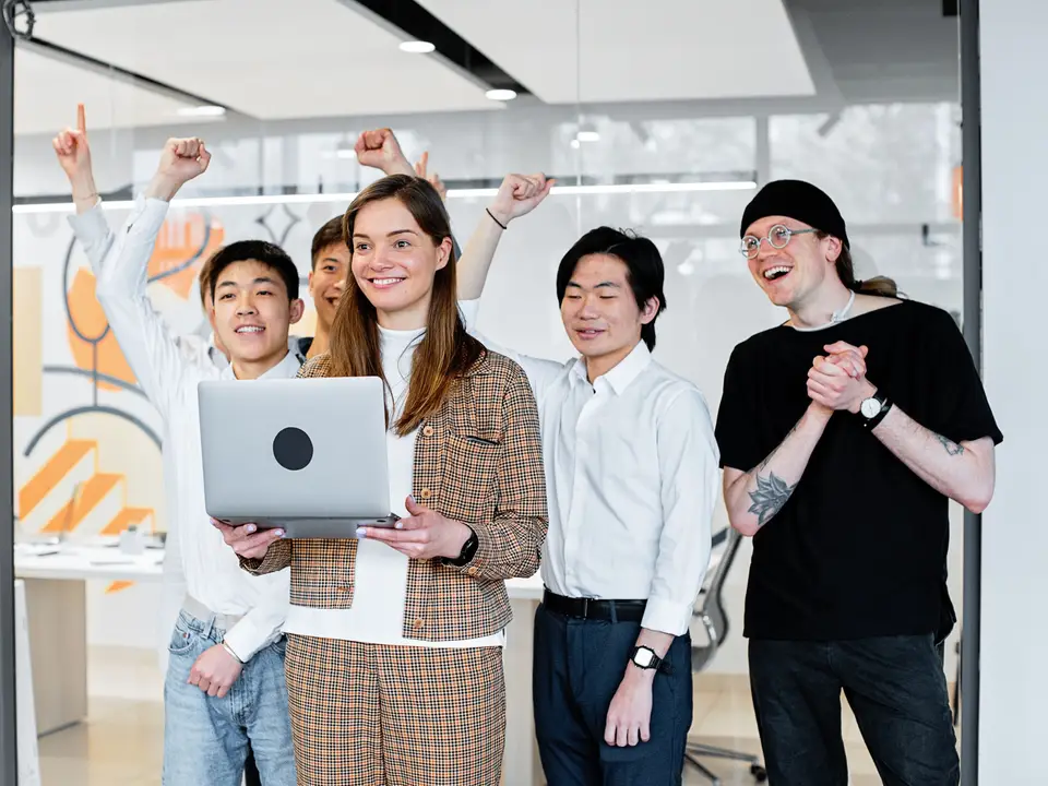 Founder presenting a product to customers in a small meeting room
