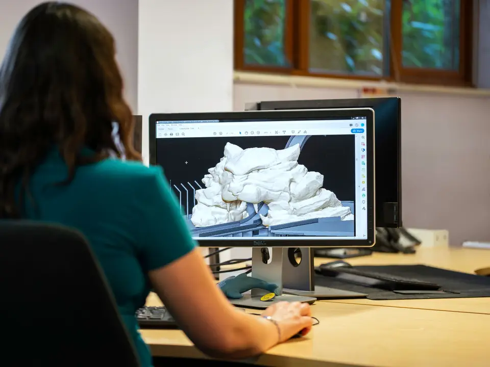 Engineer modelling a part in CAD software