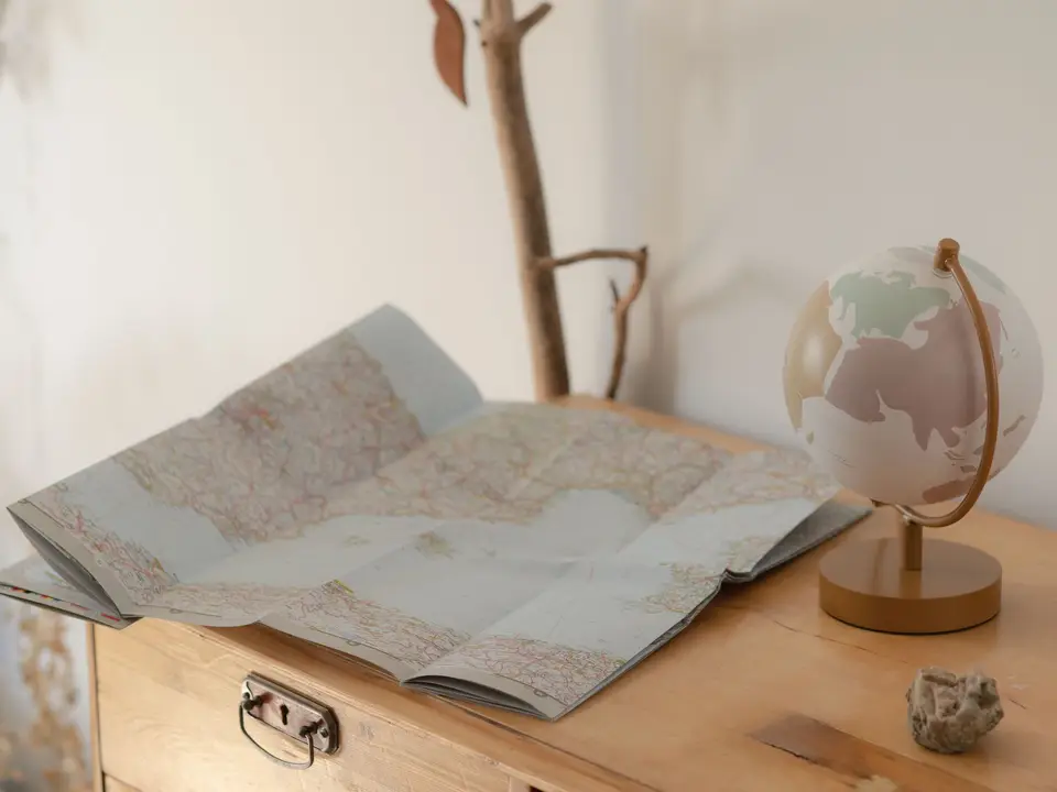 Vintage map and globe on a wooden table