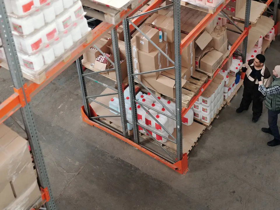 Warehouse shelf with labeled cartons ready to ship