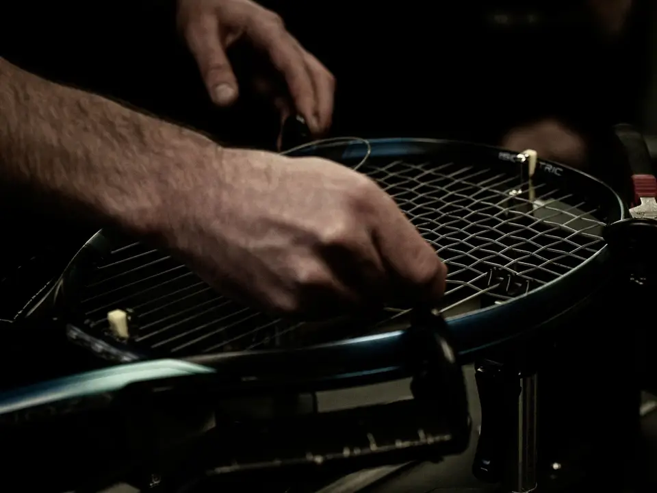 Tennis rackets and stringing machine