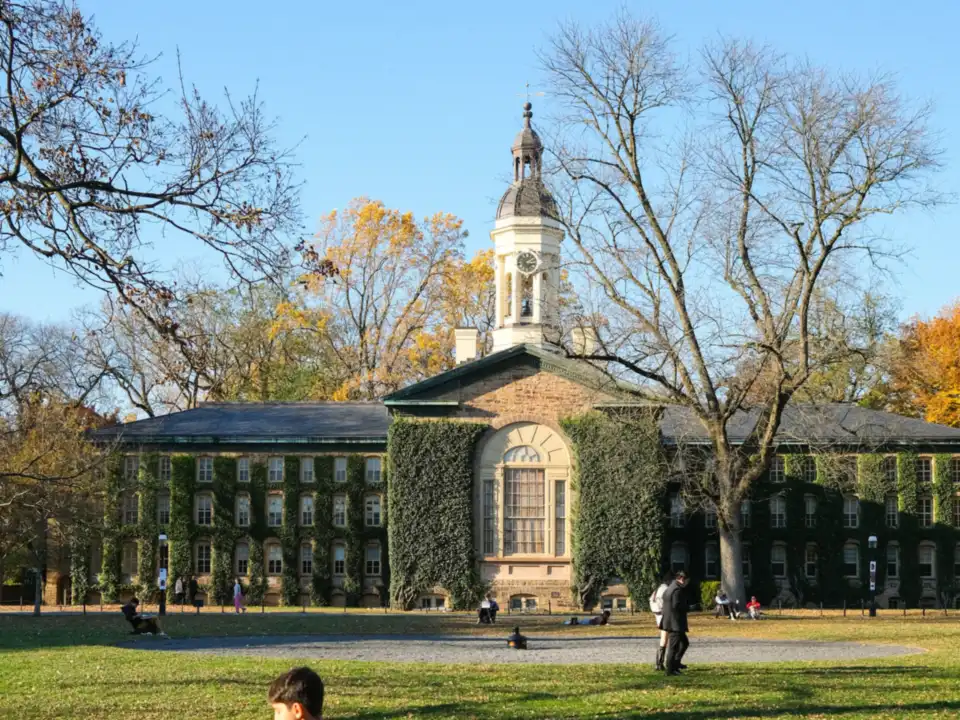 Historic ivy-covered university building in autumn