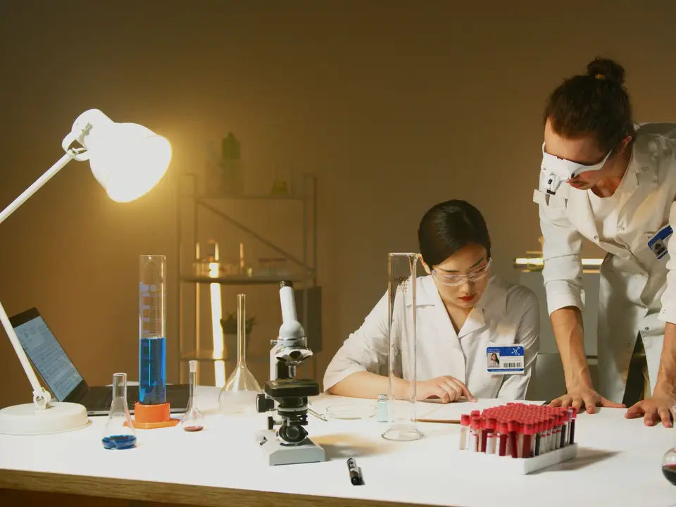 Two scientists conducting experiments in a laboratory