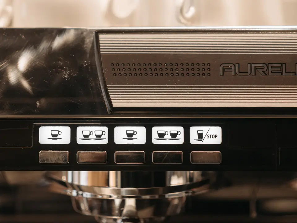Control panel of an espresso machine with brewing buttons