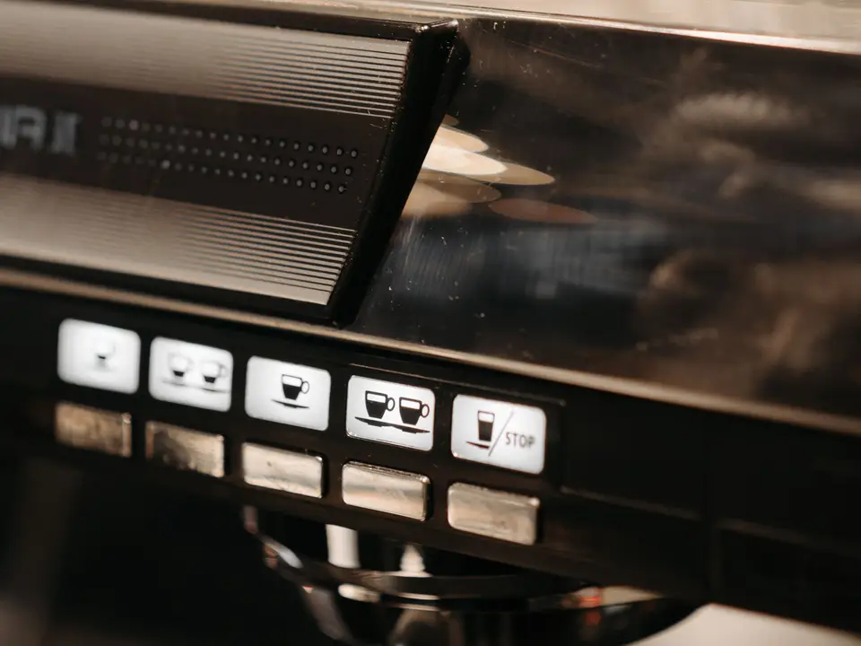 Button panel of an espresso machine showing coffee settings