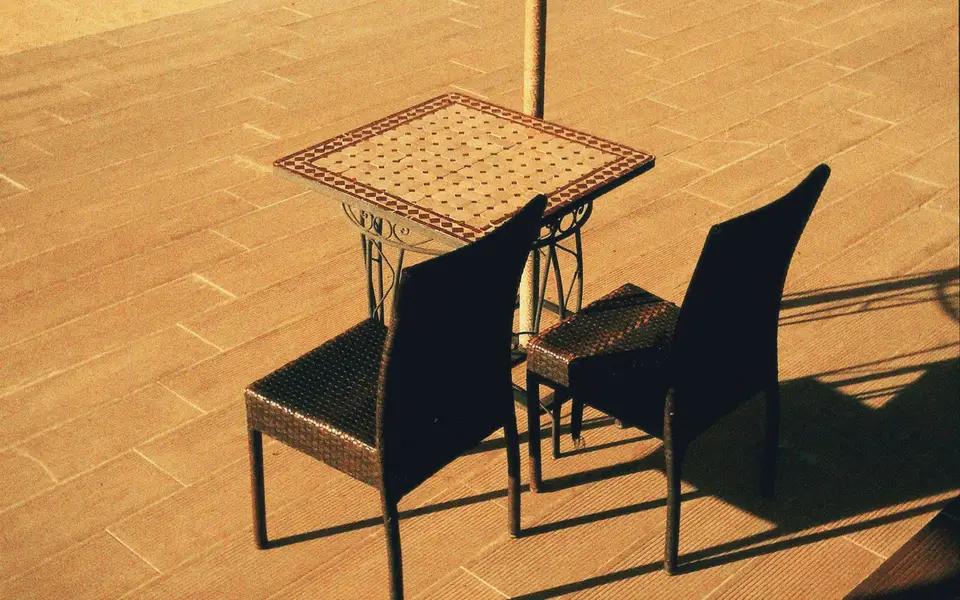 Host securing outdoor furniture before a coastal storm