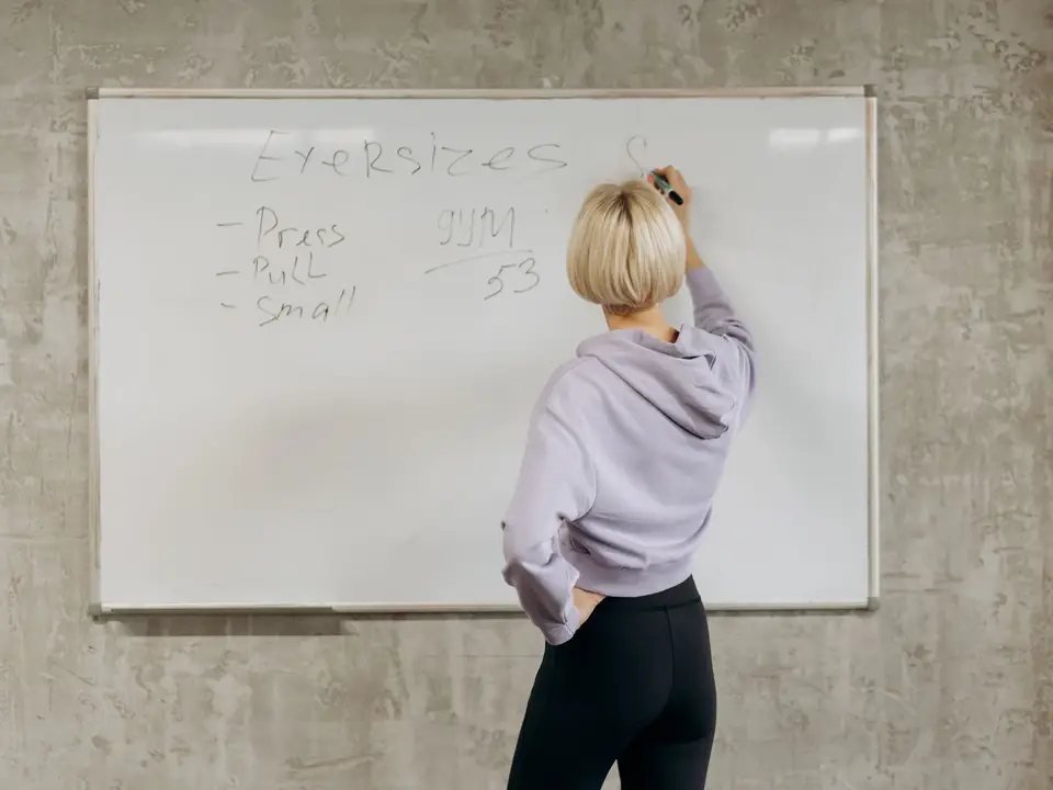 Coordinator mapping volunteer roles on a whiteboard