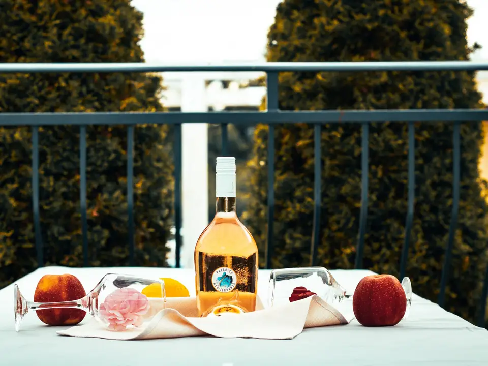 Rosé and fruit on an outdoor table