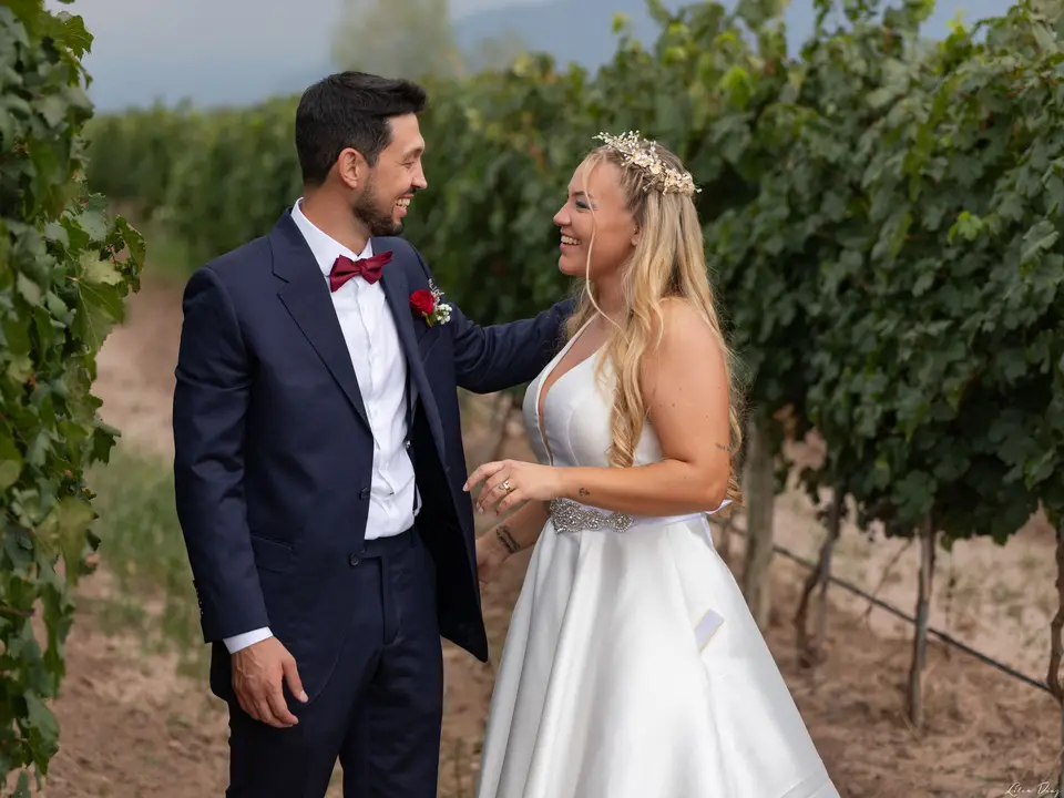 Couple walking between vines
