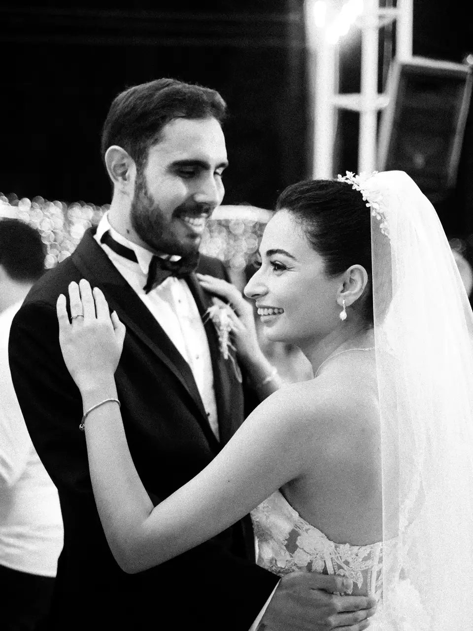 Newlyweds laughing as they dance