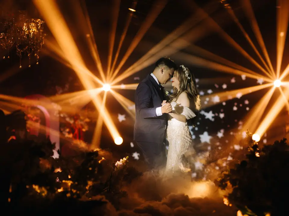 Couple dancing under lights