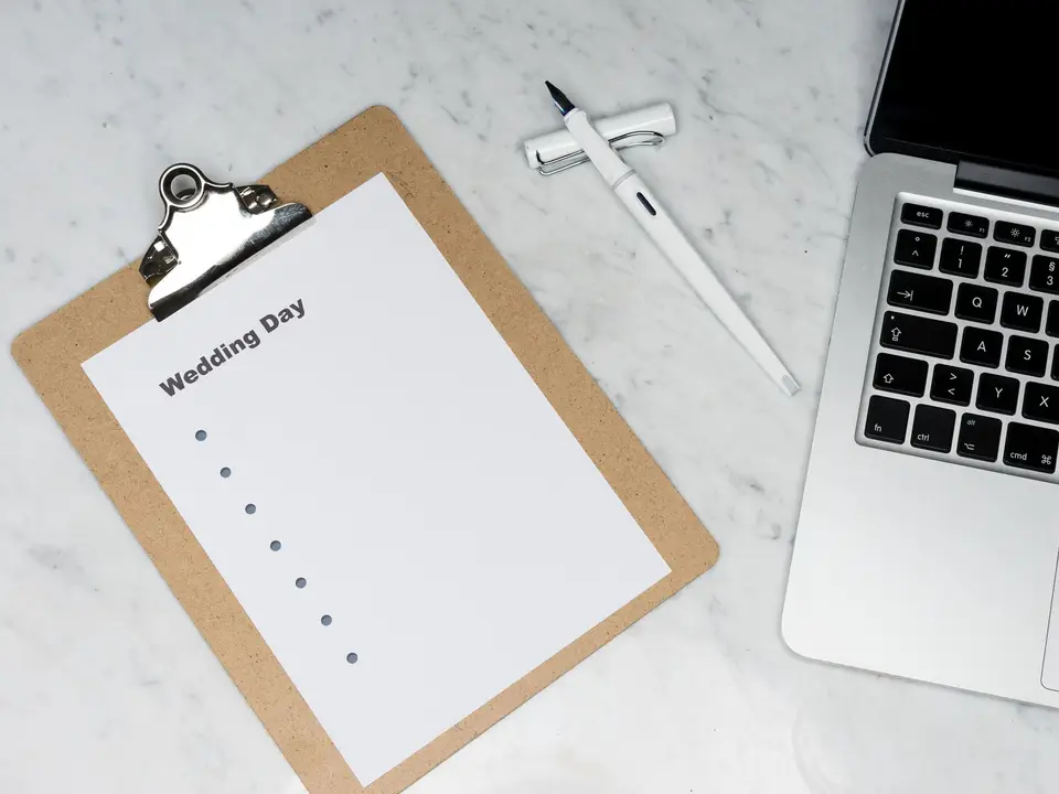 Planning desk with a clipboard and laptop