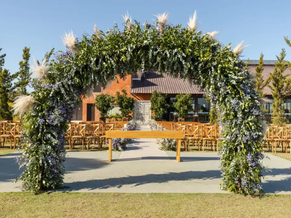 Floral arbour and wooden chairs