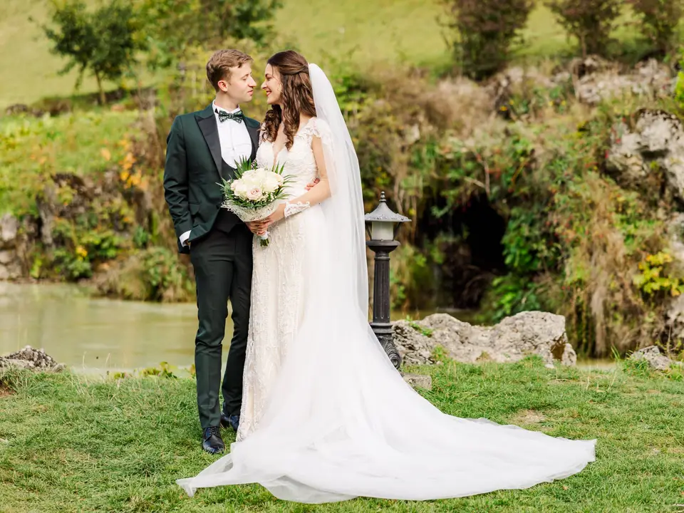 Newlyweds in a mountain meadow
