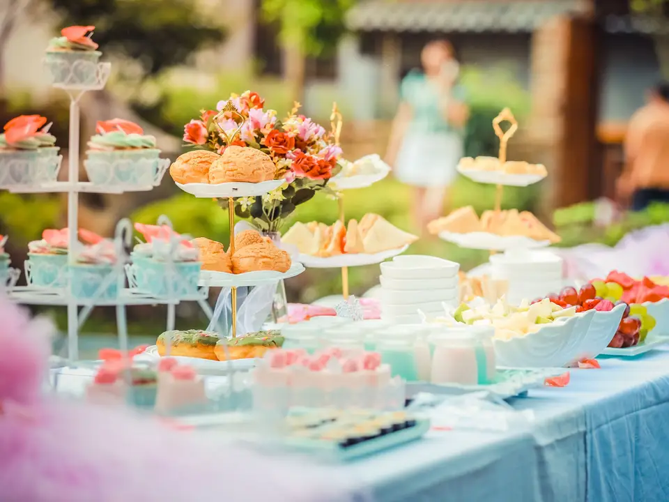 Outdoor dessert table at a garden reception
