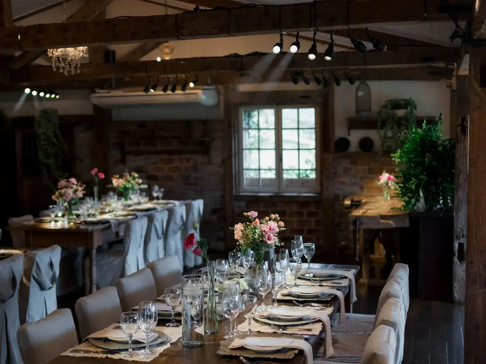 Rustic reception room with long tables