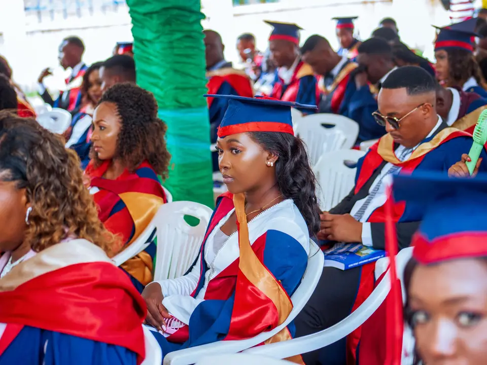 Students in caps and gowns attending a graduation ceremony, showcasing diversity and education